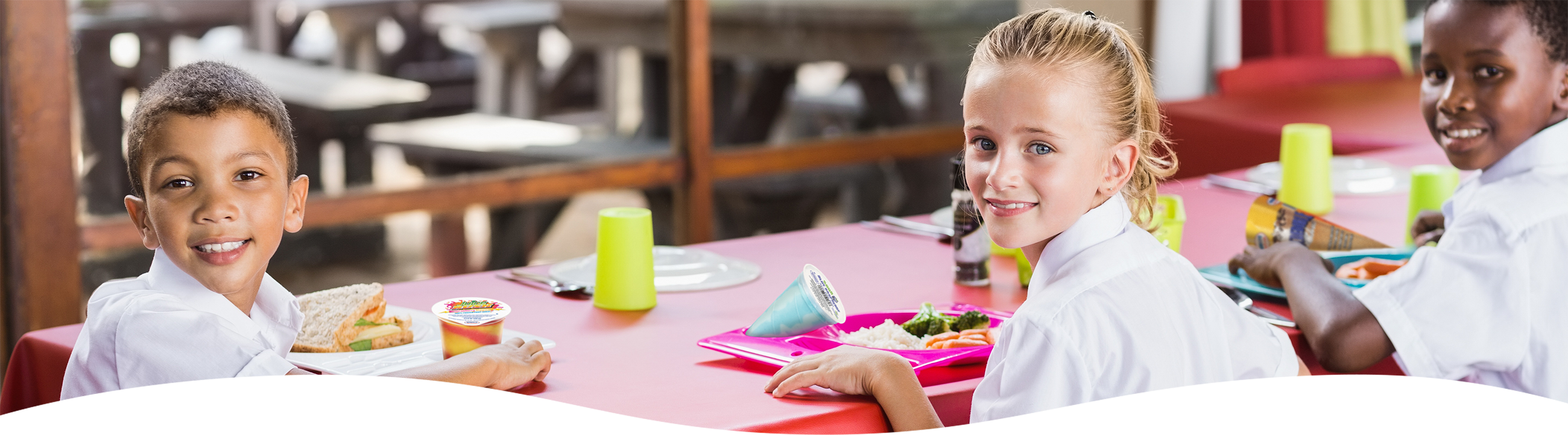 Group of children at school having lunch.